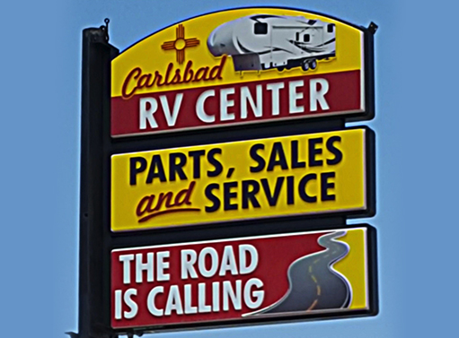 Carlsbad RV Center Parts Sales and Service The Road is Calling Sign - dynalite