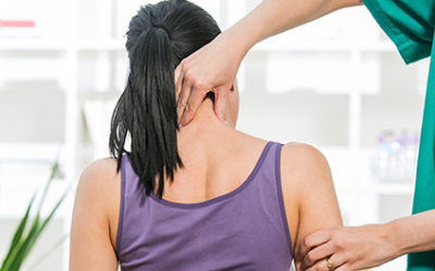 Chiropractor Working on Patient Who Walked In Because of His Business Sign