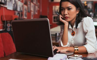 5-10 Woman in a Coffee Shop Choosing From Types of Signs