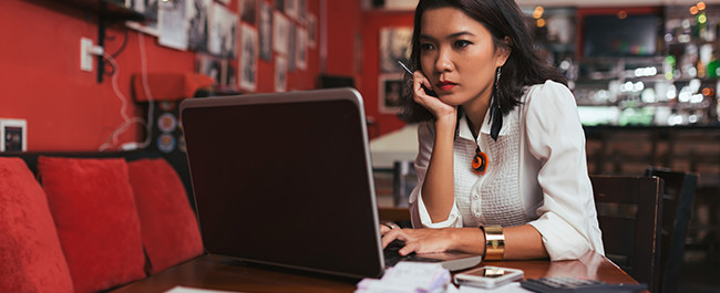 5-10 Woman in a Coffee Shop Choosing From Types of Signs