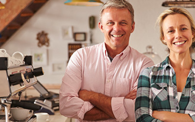 5-12 Older Couple Happy with their Business Signs