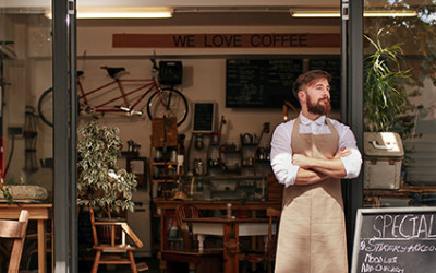 5-6 Man Standing In Front of His Business Proud of His Business Signs