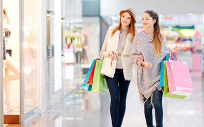 Girls Shopping Looking At An Indoor Business Signs