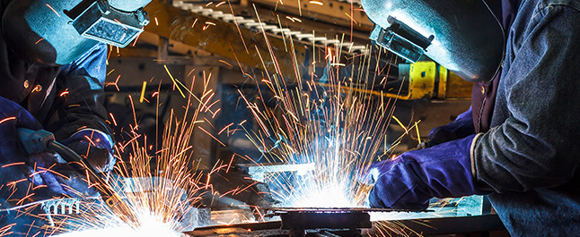 Signtronix Employee Welding An Outdoor Sign