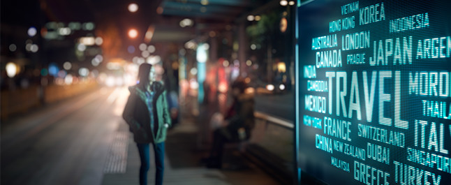 Digital Sign at a bus stop showing different travel destinations